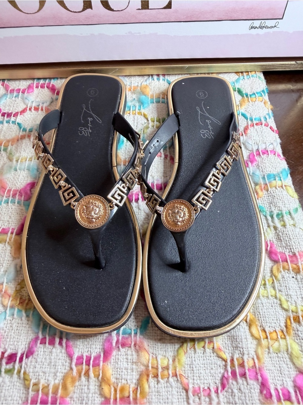 Women's Black Gold-Trim Flip Flop Sandals with Medallion Accent